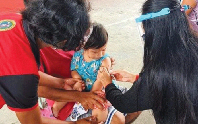 IMMUNIZATION A baby in Bacolod City gets immunized for measles-rubella as part of the Department of Health’s “Chikiting Ligtas” supplemental immunization activity. BACOLOD CITY PIO