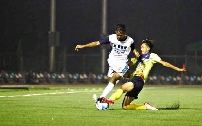 A booter (white) from Western Visayas Regional Athletic Association avoids the sliding tackle attempted by the opposition during a match in the 2019 Palarong Pambansa in Davao City. The Department of Education is eyeing for a virtual edition of the Palaro this 2021 due to the COVID-19 pandemic. Edge Davao