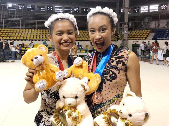 Negrense gymnasts Althea Descutido (left) and Kiana Marie Alagaban (right) reap two gold medals each during the 1st MK Rhythmic Gymnastics International Online Competition recently. ALTHEA DS