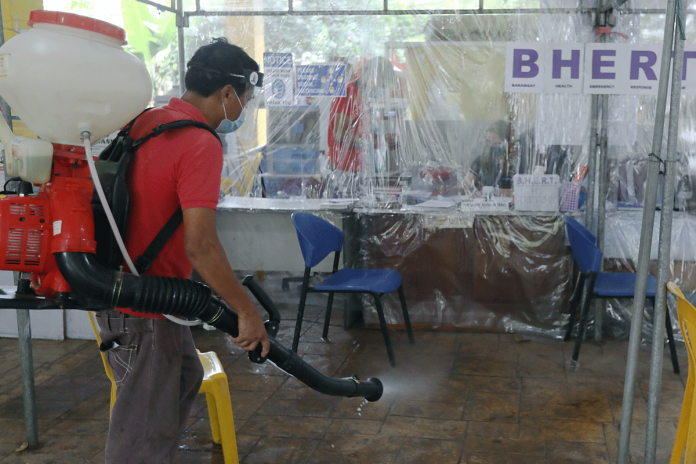 A man disinfects the Barangay Health Emergency Response Team office in Novaliches Fairview, Quezon City. This move, aims to prevent the spread of coronavirus disease 2019 (COVID-19). Based on the Data from the Department of Health, the country has a total of 731,894 COVID-19 cases. OLIVER MARQUEZ/PNA