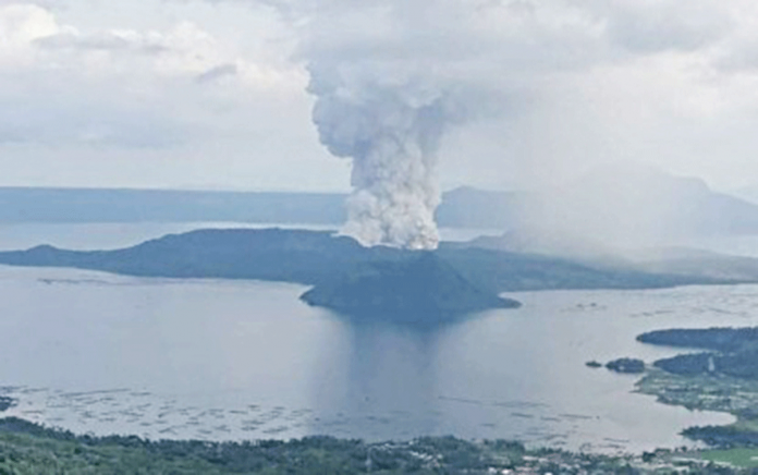 Taal Volcano emits ashes and smoke from its main crater in an eruption on Jan. 12, 2020. On Tuesday, it has been placed under alert level two by the Philippine Institute of Volcanology and Seismology. JOHN PAUL FERMA VIA PNA