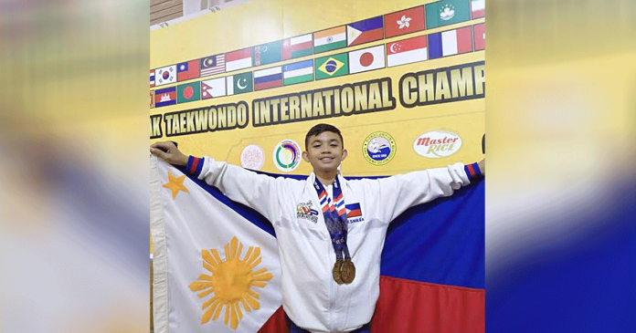 Ilonggo Cyd Edryc Esmaña proudly holds the Philippine flag with medals hanging around his neck. He lands at second place in the overall male championship of the 3rd Lents Taekwondo Worldwide Sports Online Poomsae Open Championships.