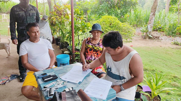 Barangay Captain Joewinny Giganto (left) of Barangay Calang, Dueñas, Iloilo was arrested yesterday, March 2. A grenade and a .45-caliber pistol loaded with seven live ammunitions were recovered from his possession. PRO-6