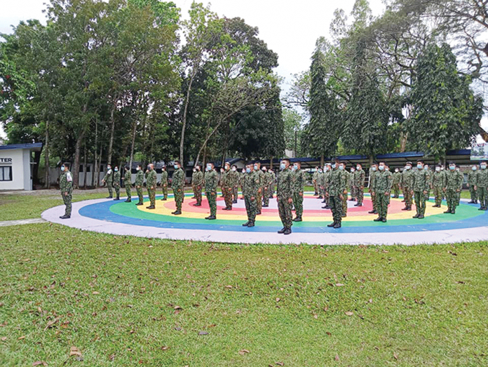 Cops join a flag ceremony in Camp Alfredo M. Montelibano Sr. in Bacolod City. Ninety-nine percent of police officers of the Negros Occidental Police Provincial Office signified willingness to be vaccinated against coronavirus disease 2019 (COVID-19). NOCPPO/FACEBOOK