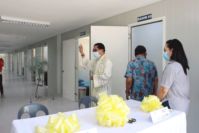 A priest blesses this 16-room quarantine facility built by the Department of Public Works and Highways for the provincial government of Guimaras at the capitol grounds in Barangay San Miguel, Jordan town. PHOTO COURTESY OF BUENAVISTA, GUIMARAS LGU