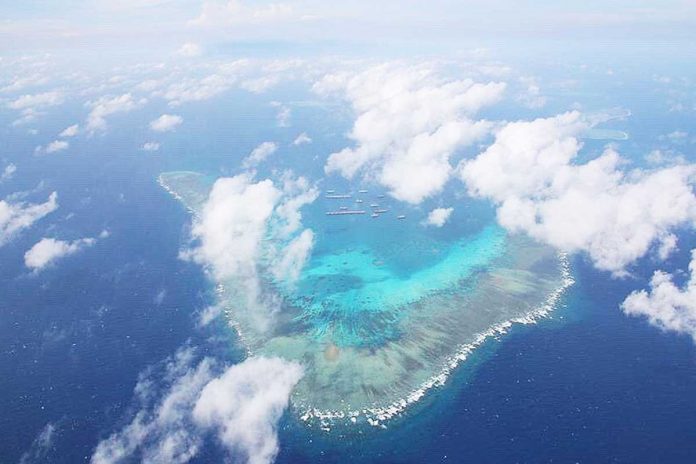 This is the Julian Felipe Reef in the West Philippine Sea. It is a large boomerang-shaped shallow coral reef at the northeast of Pagkakaisa Banks and Reefs (Union Reefs), located approximately 175 nautical miles west of Bataraza, Palawan. Hundreds of Chinese vessels were seen in this area and China claims that it is a part of its territory. ARMED FORCES OF THE PHILIPPINES VIA ABS-CBN NEWS