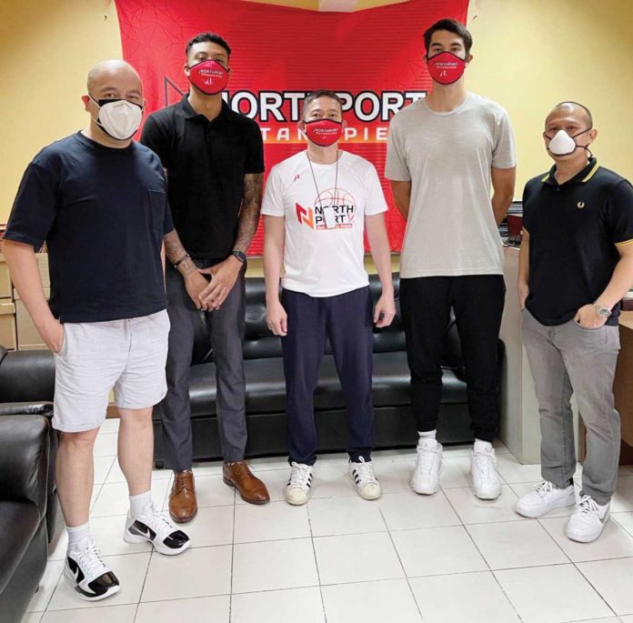 Jamie Malonzo (second from left) and Troy Rike (second from right) are now part of the NorthPort Batang Pier after they have signed their rookie deals on Monday. BONNIE TAN/NORTHPORT BATANG PIER