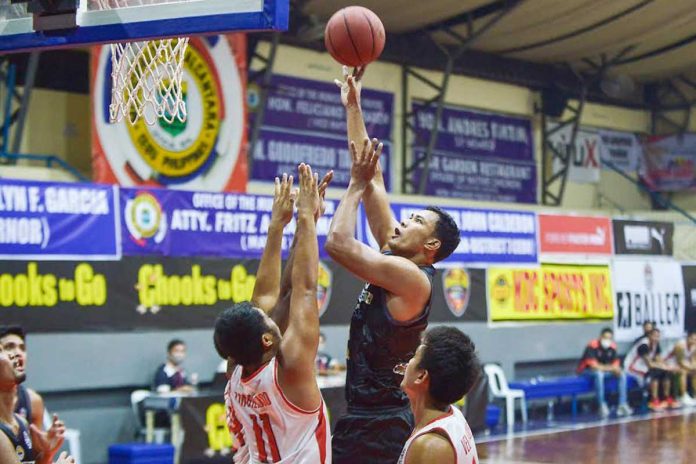 Jhaymo Eguilos escapes the defense of Dumaguete Warriors to shoot the ball for MJAS Zenith-Talisay City Aquastars on Tuesday night at the Alcantara Civic Center in Cebu. The Aquastars maintained its unblemished slate in the Pilipinas VisMin Super Cup. PILIPINAS VISMIN SUPER CUP.