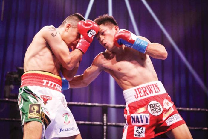 Filipino boxer Jerwin Ancajas (right) connects a right hook punch to the body of Mexican Johnathan Rodriguez during their IBF world super flyweight match, Saturday, at Mohegan Sun Arena in Connecticut, United States of America. SHOWTIME