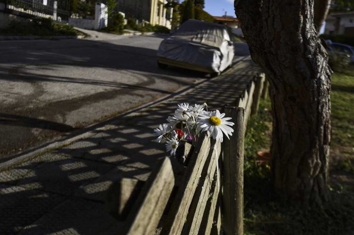 Flowers are placed at the site where journalist Giorgos Karaivaz was murdered in Alimos, on the southern coast of Attica, Greece, 9 April 2021, Dimitris Lampropoulos/Anadolu Agency via Getty Images