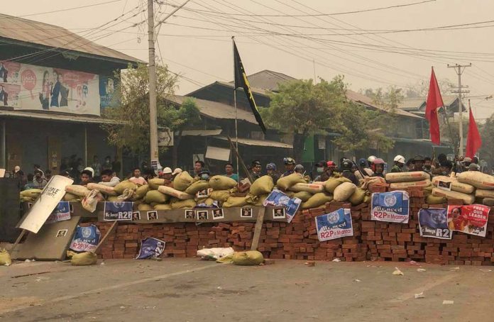 Protesters defend themselves from the military junta in Kale, Sagaing region in Myanmar as they call for the release of their detained leader Aung San Suu Kyi. REUTERS