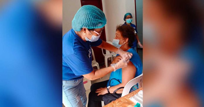 This senior citizen of Pandan, Antique receives her first shot of the vaccine against coronavirus disease 2019. PHOTO FROM THE FACEBOOK PAGE OF THE MUNICIPALITY OF PANDAN, ANTIQUE