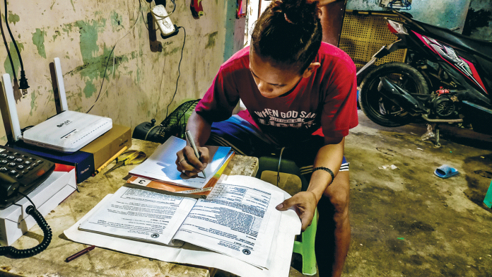 The 16-year-old Jerry Calzado of Cayos National High School in Dumangas, Iloilo answers his module as part of the distance learning implemented by the Department of Education. When the coronavirus disease 2019 strikes, the education sector was greatly affected since students rely on modules and printed materials to learn. PN FILE PHOTO