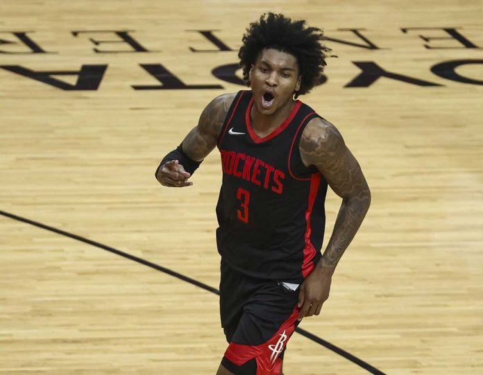 Houston Rockets' Kevin Porter Jr. is jubilant after scoring a basket in the fourth quarter of their basketball game against Milwaukee Bucks on Thursday. Porter finished the match with career-high 50 points. TROY TAORMINA/AP