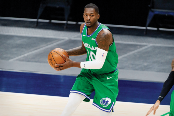 Dorian Finney-Smith scores a game-winning basket on Saturday night to help Dallas Mavericks escape with a 125-124 victory over Washington Wizards. USA TODAY