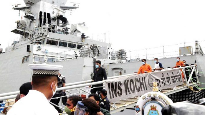 A navy warship brings back survivors from the sunken barge on Wednesday. DEFENCE PRO