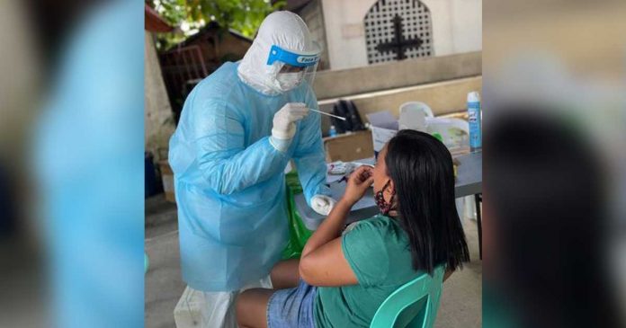 An Aklanon undergoes a nasal swab for coronavirus testing. Aklan, which is currently under modified general enhanced community quarantine, recorded 1,819 cases with 42 deaths since the start of the pandemic last year. PHOTO AKLAN PESU