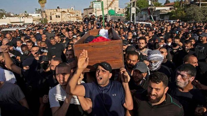 A funeral is held for a man who died during an unrest in Lod, Israel. GETTY IMAGES