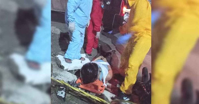 Rescuers prepare to carry this motorist on a stretcher following an accident in Barangay Villavert-Jimenez, Pandan, Antique on May 22, 2021. Unfortunately, the motorist died.