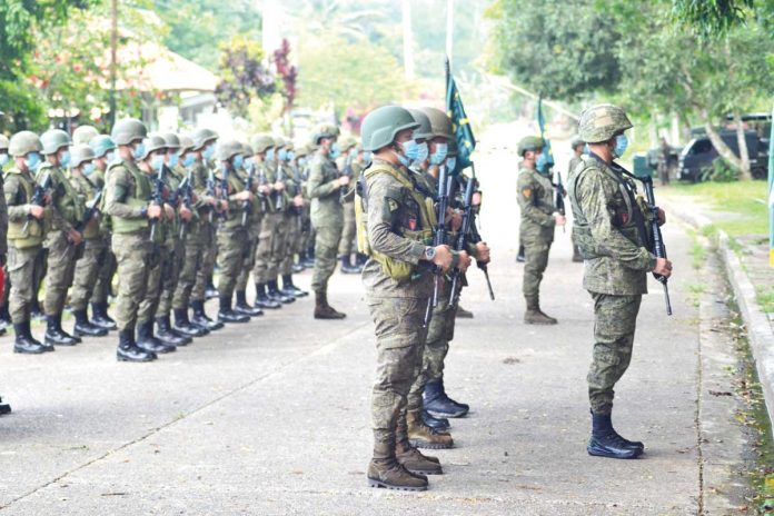 Soldiers of the Philippine Army’s 82nd Infantry Battalion formerly based in Miag-ao, Iloilo line up during a send-off ceremony in Barangay Pawak, Saguiaran, Lanao del Sur. They will be deployed to Cebu and Siquijor as augmentation force against insurgents there. PHILIPPINE ARMY