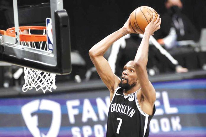 Brooklyn Nets’ Kevin Durant dunks against the Milwaukee Bucks during Game 1 of their NBA basketball second-round playoff series on Saturday. AP/ADAM HUNGER