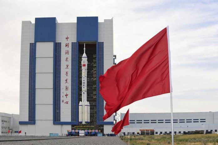 In this photo released by Xinhua News Agency, the Shenzhou-12 manned spaceship with its Long March-2F carrier rocket is being prepared at the launching area of Jiuquan Satellite Launch Center in northwestern China Gansu province, on Wednesday, June 9, 2021. WANG JIANGBO/XINHUA VIA AP