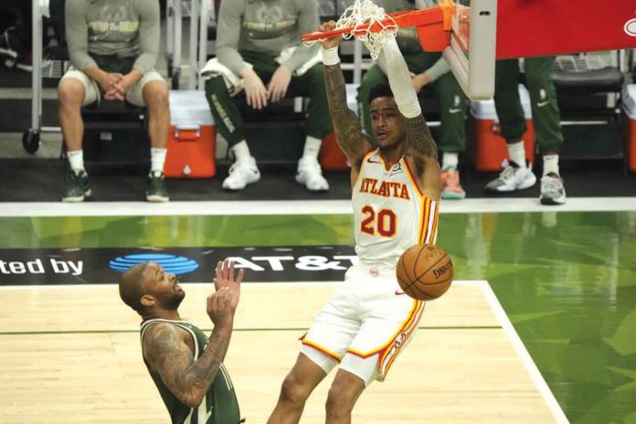 Atlanta Hawks' John Collins dunks against the Milwaukee Bucks during the second half of Game 1 of their Eastern Conference Finals on Wednesday. AP PHOTO/MORRY GASH