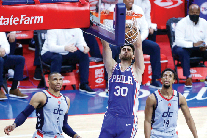 Philadelphia 76ers' Fukuan Korkmaz dunks against the Washington Wizards during Game 5 of their NBA Eastern Conference first-round playoffs series on Wednesday. GETTY IMAGES