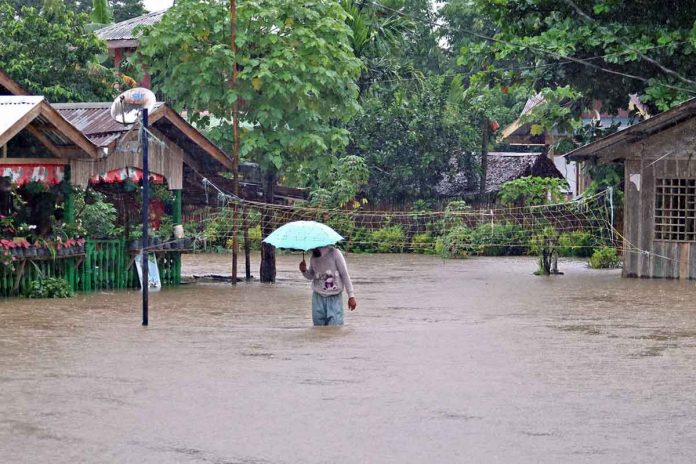 Floodwaters rise in the village of Los Angeles in Butuan City as Tropical Storm “Dante” (international name: Choi-wan) dumps heavy rain in Agusan del Norte province on Monday and Tuesday. ERWIN M. MASCARIÑAS