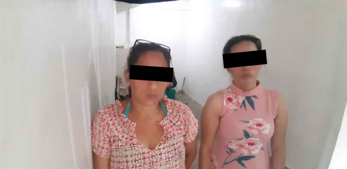 Renalie Lavalle (left) of Barangay Guzman Jesena, Mandurriao, Iloilo City and Marie Trexie Joguilon of Barangay Ungka II, Pavia, Iloilo were caught in an entrapment operation on Bonifacio Drive, Iloilo City yesterday morning. JAPHET FAJARDO/PN