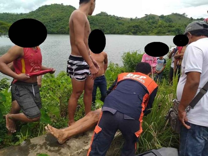 Rescuers and volunteers retrieve the body of Jonathan Galo from Marugo Lake in Barangay San Antonio, Tapaz, Capiz.