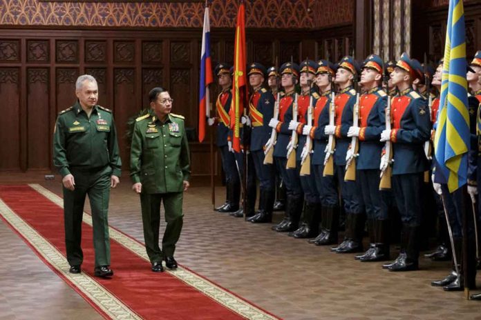 Russia's Defense Minister Sergei Shoigu (left) and Myanmar's Commander in-Chief Senior General Min Aung Hlaing (right) walk past the honor guard prior to their talks in Moscow, Russia, June 22, 2021. VADIM SAVITSKIY/MINISTRY OF DEFENSE OF THE RUSSIAN FEDERATION VIA REUTERS