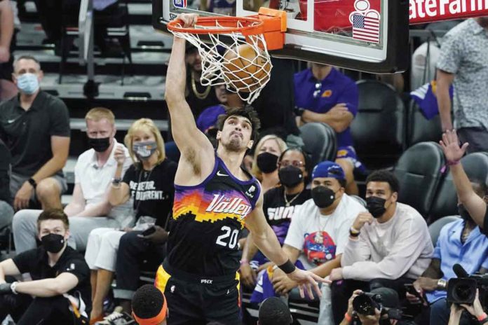 Phoenix Suns’ Dario Saric dunks against the Denver Nuggets during the first half of their NBA second-round playoff series on Wednesday. AP/MATT YORK