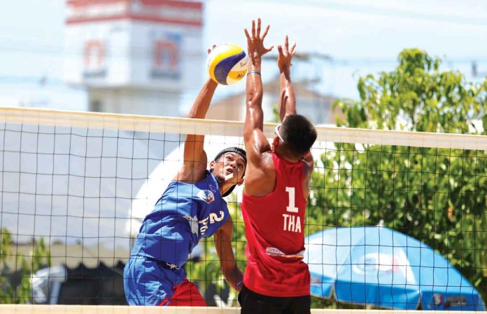 Philippines’ Alexander Iraya (2) attacks the Thai opponent with a spike during the 3rd Asian U19 Beach Volleyball Championships Pool A match on Sunday. AVC