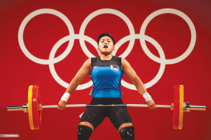 Filipina weightlifter Erleen Ann Ando fails to seize a medal in the Tokyo Olympics women's 64-kilogram Group A weightlifting event at the Tokyo International Forum in Tokyo, Japan. She settled for a seventh-place finish with a total of 222 kilograms lift. CHRIS GRAYTHEN/GETTY IMAGES