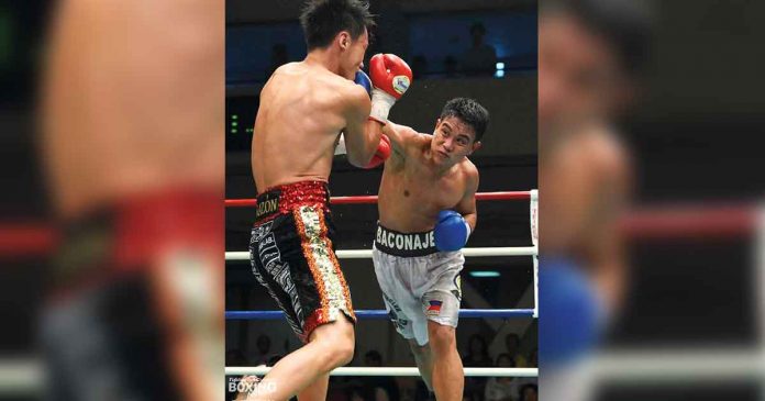 FIGHTING IN 4 CORNERS. In this file photo, Arnel Baconaje launches an attack against an opponent. On Saturday night, the Ilonggo boxer crushed Ivor Lastrilla via second-round knockout to win their non-title clash.