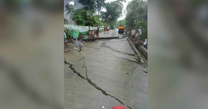 The heavy rains may have softened and eroded the soil beneath this cracked road in Barangay Atiotes, Tobias Fornier, Antique yesterday. PHOTO BY RIZA SERILLA 