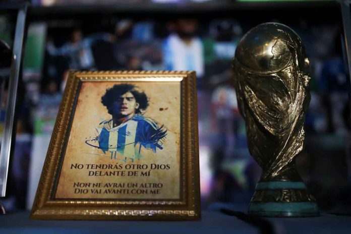 A picture of Diego Maradona and a replica of the World Cup trophy are pictured on an altar at the first Mexico's church in memory of soccer legend Diego Armando Maradona in San Andres Cholula, Puebla state in Mexico. REUTERS/EDGARD GARRIDO