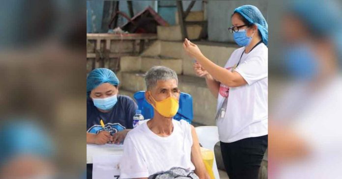 A medical frontliner prepares the COVID-19 jab that she will administer to an elderly in one of the vaccination sites in Iloilo City. Vaccine czar Carlito Galvez Jr. says over 5.5 million Filipinos are now fully vaccinated against the deadly virus. JERRY TREÑAS