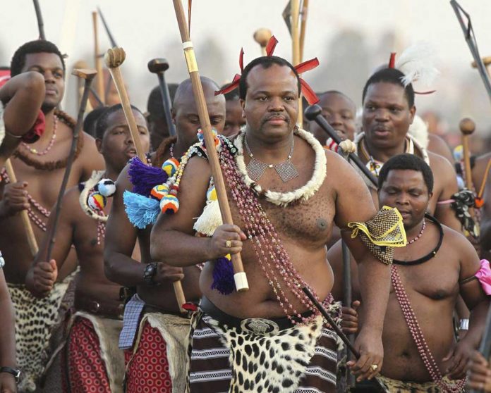 In this file photo Eswatini's King, Mswati III (front), dances during a Reed Dance in Mbabane. Pro-democracy activists in the country previously known as Swaziland, vowed on Tuesday to intensify demonstrations against the monarchy until it makes democratic reforms and unbans all opposition parties. AP FILE PHOTO/THEMBA HADEBE