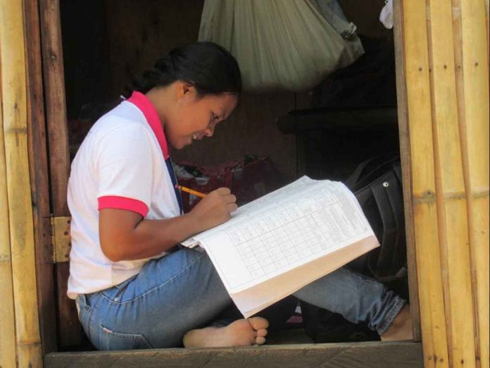 A census enumerator of the Philippine Statistics Authority conducts data collection through house-to-house visits during the 2020 Census of Population and Housing. PSA PHOTO