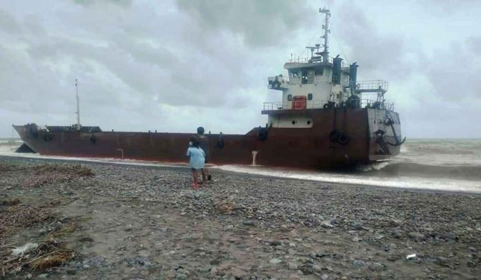 STUCK. Barge “ASC Lara” gets stranded in Barangay Oloc, Laua-an, Antique. It initially ran aground in Barangay Ilaures, Bugasong, Antique and was again buffeted by strong winds and big waves while being towed towards the municipality of Pandan, Antique. PHOTO BY BENJAMIN TRADIO FROM DISCOVER ANTIQUE FACEBOOK PAGE