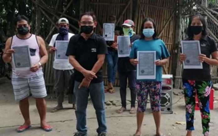 These are recipients of certificates of land ownership award for 19.58 hectares of property with Municipal Agrarian Reform Program Officer Rodrigo Jose Renato Defiño during the distribution ceremony in Barangay Bagtic, Silay City, Negros Occidental on June 21, 2021. PHOTO BY DAR NEGROS OCCIDENTAL I-NORTH