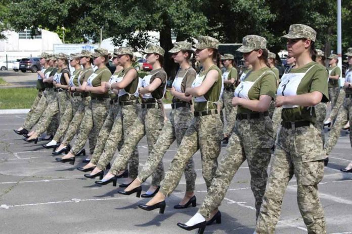 Ukrainian female soldiers wear heels while taking part in the military parade rehearsal in Kyiv, Ukraine. UKRAINIAN DEFENSE MINISTRY PRESS OFFICE VIA AP