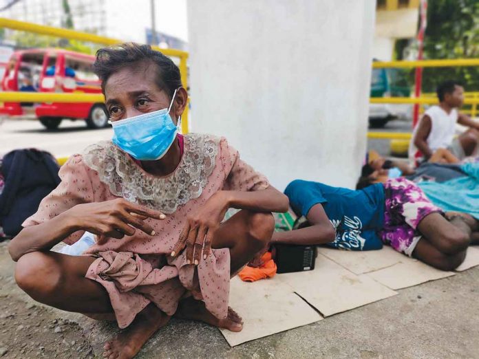 Wearing a facemask, Tata Salveo, 45, shares they, too, in the Ati community are worried for their health amid the coronavirus disease pandemic. PANAY NEWS PHOTO