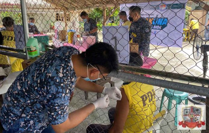 A person deprived of liberty receives his first dose of the Sinovac vaccine at the Iloilo District Jail Male Dormitory of the Bureau of Jail Management and Penology in Barangay Ungka, Jaro, Iloilo City. ICDJ-MD/BJMP