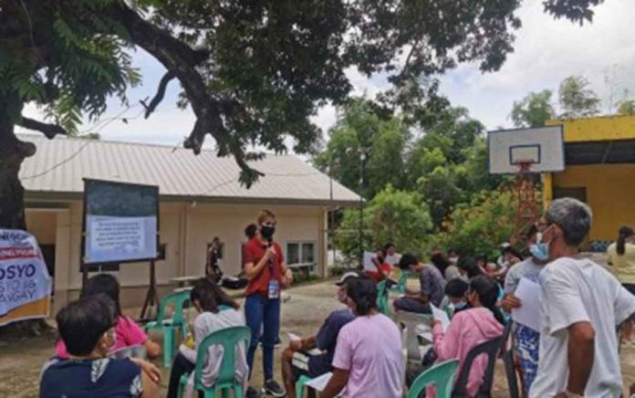 Ma. Kristine Legada (red), DTI-Antique Negosyo Center business counselor, conducts orientation among beneficiaries of the Livelihood Seeding Program-Negosyo Serbisyo sa Barangay in a barangay in Antique province. The DTI will start distributing sari-sari store packages to barangay microentrepreneurs in the last week of August. DTI ANTIQUE