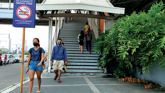 It is important to continue observing the minimum public health standards after vaccination against coronavirus, according to the Department of Health, referring to the wearing of facemask and face shield, observing physical distancing, and proper hand washing / disinfection. Photo shows masked people in downtown Iloilo City. PANAY NEWS PHOTO