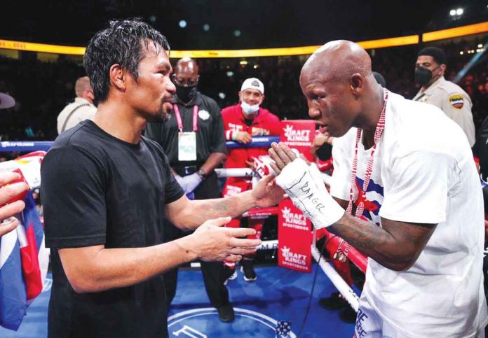 Cuban boxer Yordenis Ugas (right) praises Manny Pacquiao after their WBA world welterweight championship encounter on Sunday. "Manny Pacquiao might be in his 40s, but he gave me a very good fight," says Ugas who won via unanimous decision. CHOOKS-TO-GO