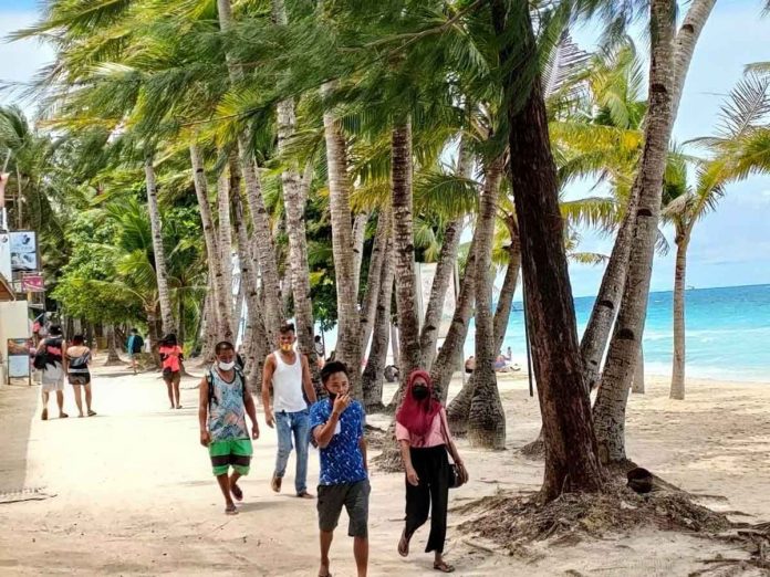 Boracay Island vacationers wear facemasks, albeit some are not wearing them properly. A Boracay Action Plan geared towards investment sustainability and balanced development in the island shall be formulated and implemented. But that will happen only when the Boracay Island Development Authority is formed.